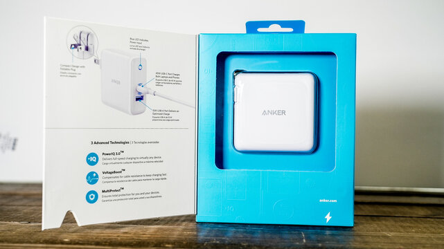 NORWALK, CT, USA - MARCH 2, 2026: White wall charger in blue retail box, displaying charger features and advanced technologies for charging electronic devices