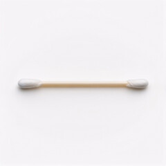 A single cotton swab lies horizontally on a plain white background