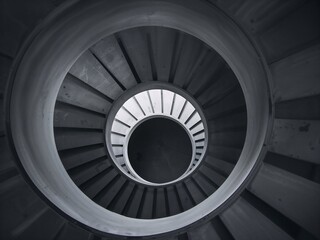 Fototapeta premium Top Down View of Minimalist Smooth Concrete Spiral Staircase