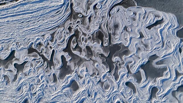 Stunning aerial view of icy glacial landscape with unique melt patterns