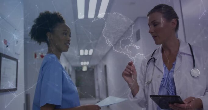 Doctor lifting finger pointing tablet globe overlay appearing nurse walking confirming medical data