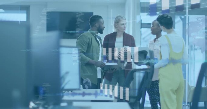 Man shifting laptop, woman gesturing, team reviewing business data with graphs showing on glass