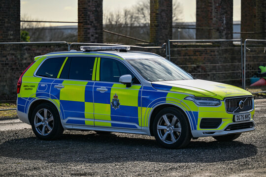 A parked Merseyside Police ANPR emergency traffic car showing the hi-visibility yellow and blue reflective batternberg.