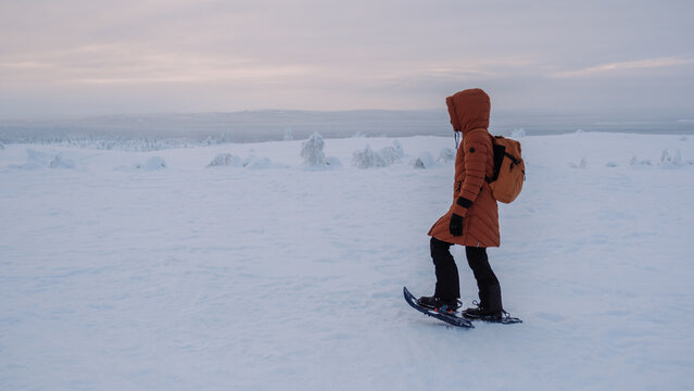 Walking through the winter wonderland of Akaslompolo in Lapland, Finland