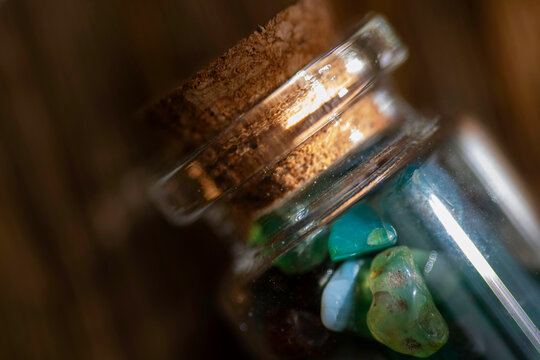 green agate bottle on a wooden surface
