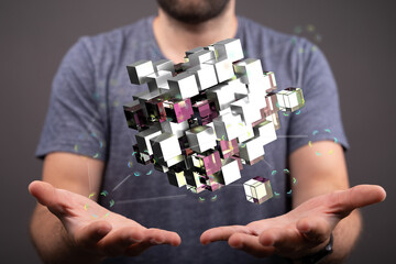 Naklejka premium Abstract 3D cube floating above hands. Business, technology and innovation concept. Digital art, futuristic design. Virt