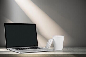 Fototapeta premium Open laptop with black blank screen in room