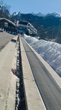 Italy, Limone Piemonte, February 26, 2026. 
Ski Resort Infrastructure &ndash; Moving Walkway to Chairlift in Italian Alps. Djundiet A.
