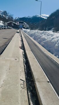 Italy, Limone Piemonte, February 26, 2026. 
Conveyor Belt Walkway to Ski Lift Station in Snowy Alpine Mountains. Djundiet A.