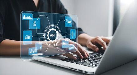 Professional using laptop with API interface overlay