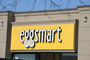 Naklejka premium bright yellow sign of Eggsmart, a breakfast restaurant chain, located here at 312 O'Connor Dr, Toronto