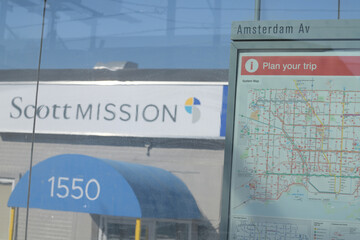 Naklejka premium bus shelter (at Amsterdam Av) with route map and defocused view of Scott Mission at 1550 O'Connor Dr, East York, Toronto 