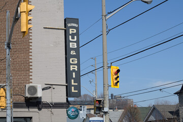 Naklejka premium wall mounted projecting sign outside California Pub & Grill (California Restaurant & Bar), located at 914 Pape Av, East York, Toronto