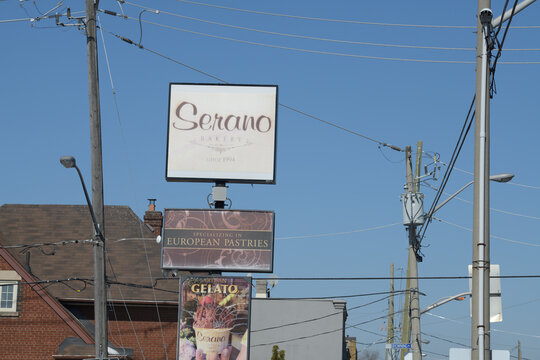 old roadside pylon signs at Serano Bakery located at 830 Pape Av, East York, Toronto
