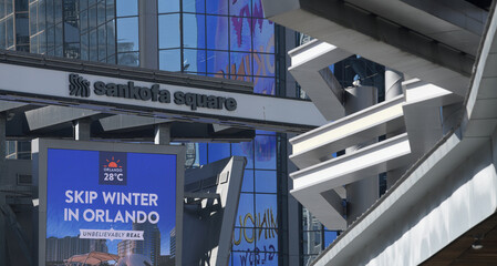 Naklejka premium metal structure and sign at Sankofa Square, incl digital advertising for travel to Orlando, Florida, in Toronto, Canada