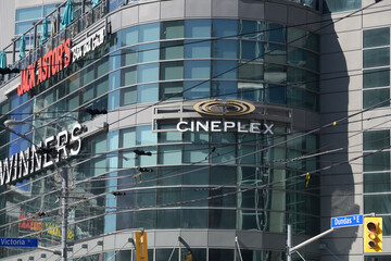Naklejka premium view of signs outside The Tenor, a shopping mall, at 10 Dundas St E, Toronto, Canada (Jack Astors, Winners, Cineplex)