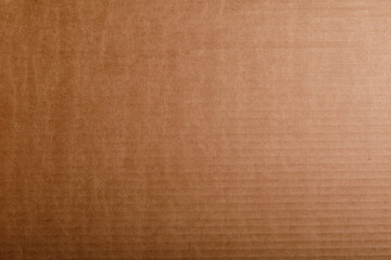 Fototapeta premium Close up of a brown cardboard texture. Great for backgrounds, packaging designs, abstract art, and commercial projects.
