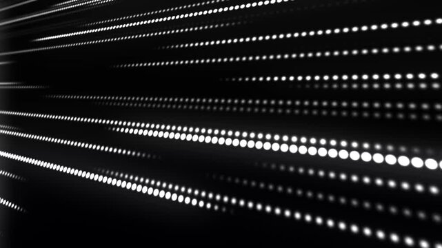 LED display. Rows of glowing dots rush forward, forming a bright stream of light and speed. Digital background. Digital display. 4K animation.