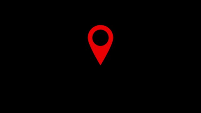 A simple red location pin icon isolated on a stark black background