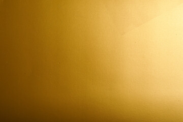 Abstract gold background texture with gradient and shine. Perfect for backgrounds, presentations, and design elements.