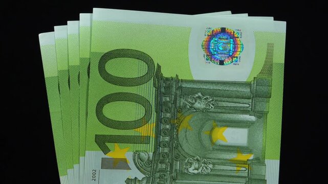 European Money. Euro banknotes. New green one hundred Euro banknotes. 500 Euros in five 100 euro banknotes 