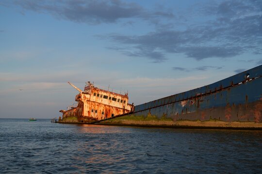 Travel romania tulcea sulina danube delta black sea rusted shipwreck lying still in sulina danube delta water