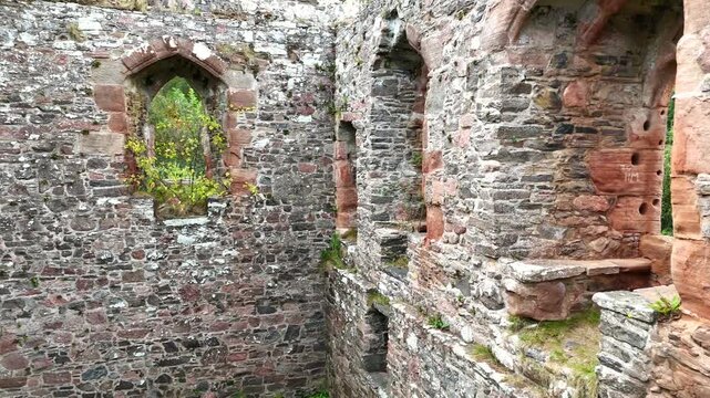 Inside the Ruins of Rait Castle: Interior Drone Exploration of Medieval Hall House Stone Walls and Gothic Windows in Nairn Scotland