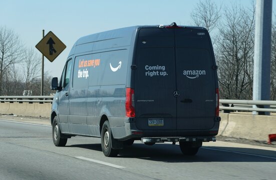 Wilmington, Delaware, U.S - Feb 28, 2026 - Amazon delivery van providing last‑mile package distribution with branded messaging and efficient logistics routing