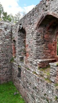 Inside the Ruins of Rait Castle: Interior Drone Exploration of Medieval Hall House Stone Walls and Gothic Windows in Nairn Scotland