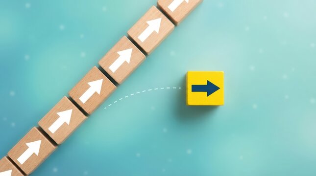 Yellow block with blue arrow moving away from line of white arrows on wooden blocks leadership