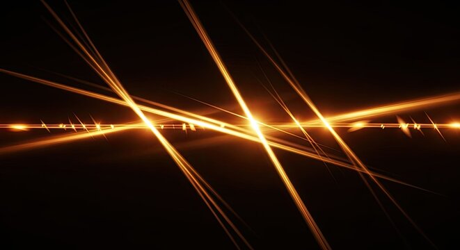 Abstract Golden Light Streaks on Black Background.