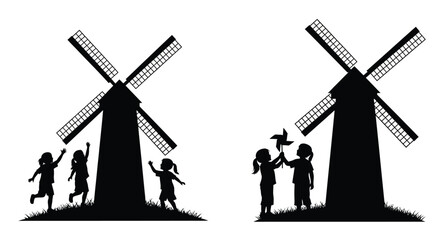 Children playing near windmills in a striking black silhouette © MDJAMAL