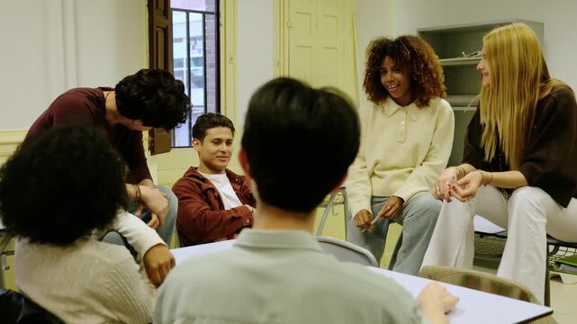 Young multiethnic students participating in a collaborative learning group discussion in a classroom