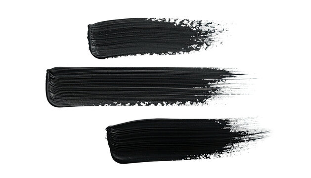 Three dark paint brush strokes isolated against a completely black background