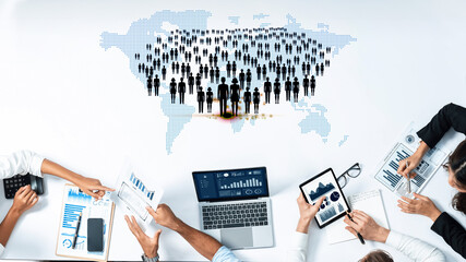 Diverse Business Team Collaborating Over Data Analytics with World Map Background and Graphs on...