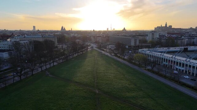Aerial shot of Blonia meadow park in Krakow city at sunrise, Poland