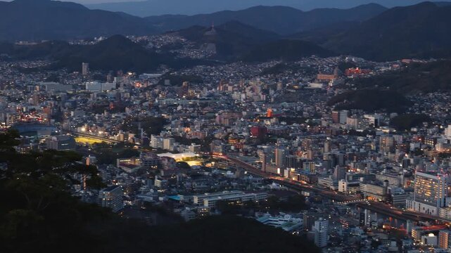 Nagasaki night panorama, Japan, aerial view, city skyline, port and mountains, seen from Inasa mount, Inasayama park, city illumination, Nagasaki prefecture, Kyushu island region, ropeway cable car