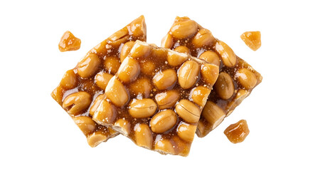 Fototapeta premium A delicious peanut brittle candy on a with scattered pieces around it