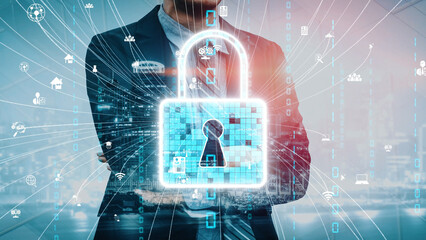 A business professional stands confidently with a glowing security lock overlay, symbolizing the importance of cyber security and data protection in the modern digital era. Xenic © InfiniteFlow