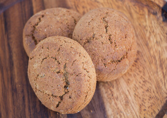 Homemade Whole Wheat Bread Rolls on Wooden Board - Rustic Bakery Concept