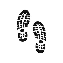 Black shoe footprints leaving trail on ground