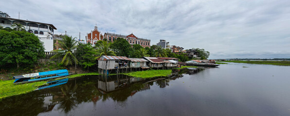 Obraz premium Aerial drone view of the iconic boulevard of Iquitos along the Río Amazonas in the Peruvian Amazon, tropical destination for travel and adventure