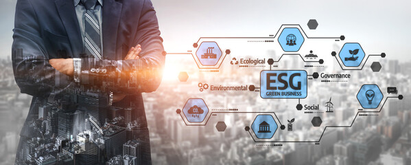 A businessman stands confidently in a suit against a modern city backdrop, highlighting key ESG concepts focused on environmental and social governance for corporate growth. Tessel © InfiniteFlow
