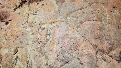 Obraz premium Rough Surface Natural Sandstone Texture Background with Organic Earth Tones.