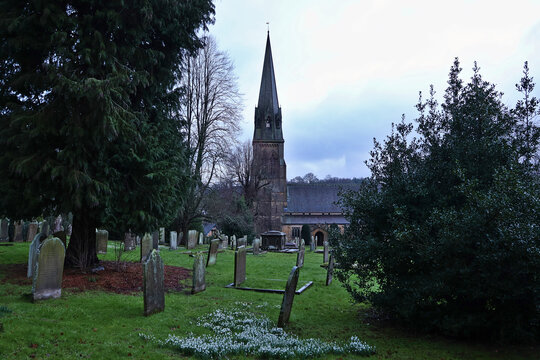St Peter's Church and Graveyard, Edensor; peaceful historic village churchyard in grounds of Chatsworth Estate in the Peak District National Park, Derbyshire, England, UK