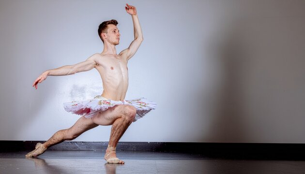 Dynamic male dancer in a light tutu performs a striking ballet movement, embodying elegance, discipline, and artistic expression with captivating form and powerful grace