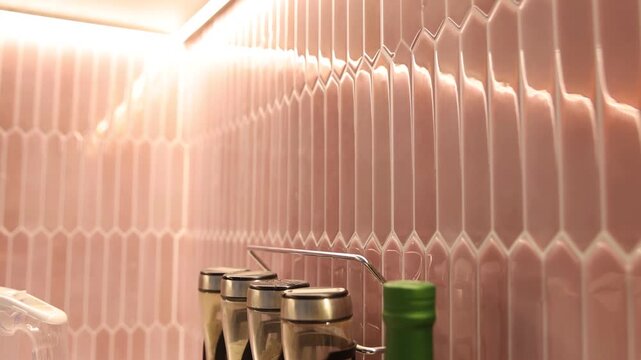 Peel and stick tiles on wall in kitchen, closeup. Camera moving in