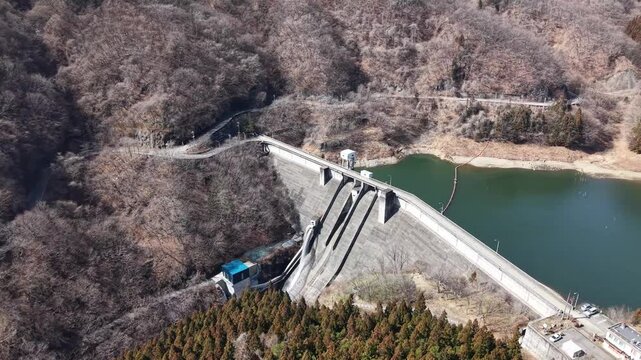 Aerial view of Kirizumi Dam in early spring, Gunma Japan mountain landscape
