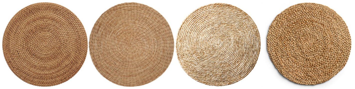 four distinct round woven table mats, crafted from natural materials, exhibiting various textures and intricate spiral patterns.