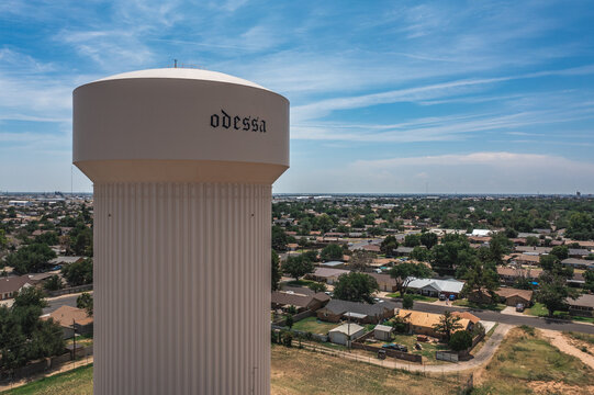 Aerial Drone View of White Water Tower and Surrounding Buildings and Roads in Odessa, Texas